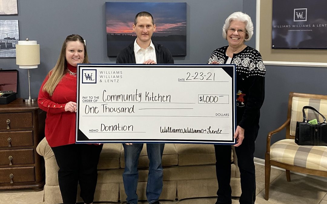 WWL Presents Donation to Community Kitchen